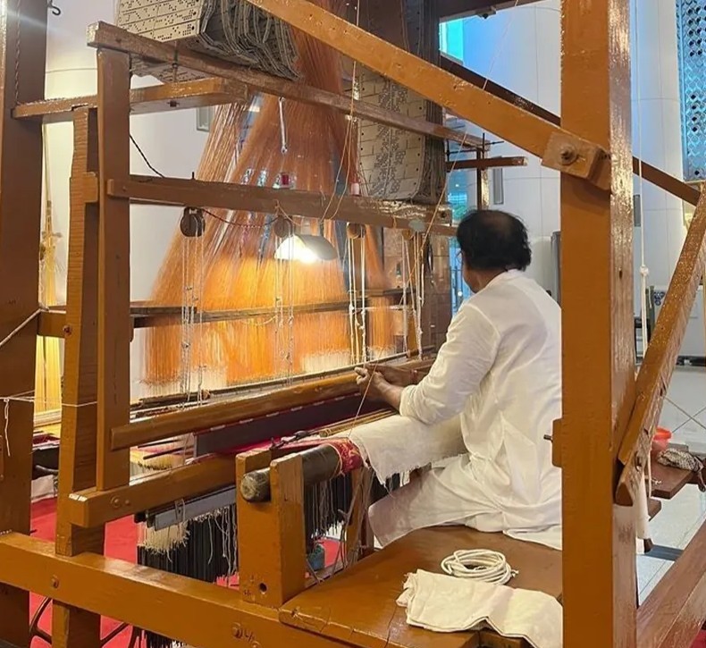 Master weaver working on traditional handloom