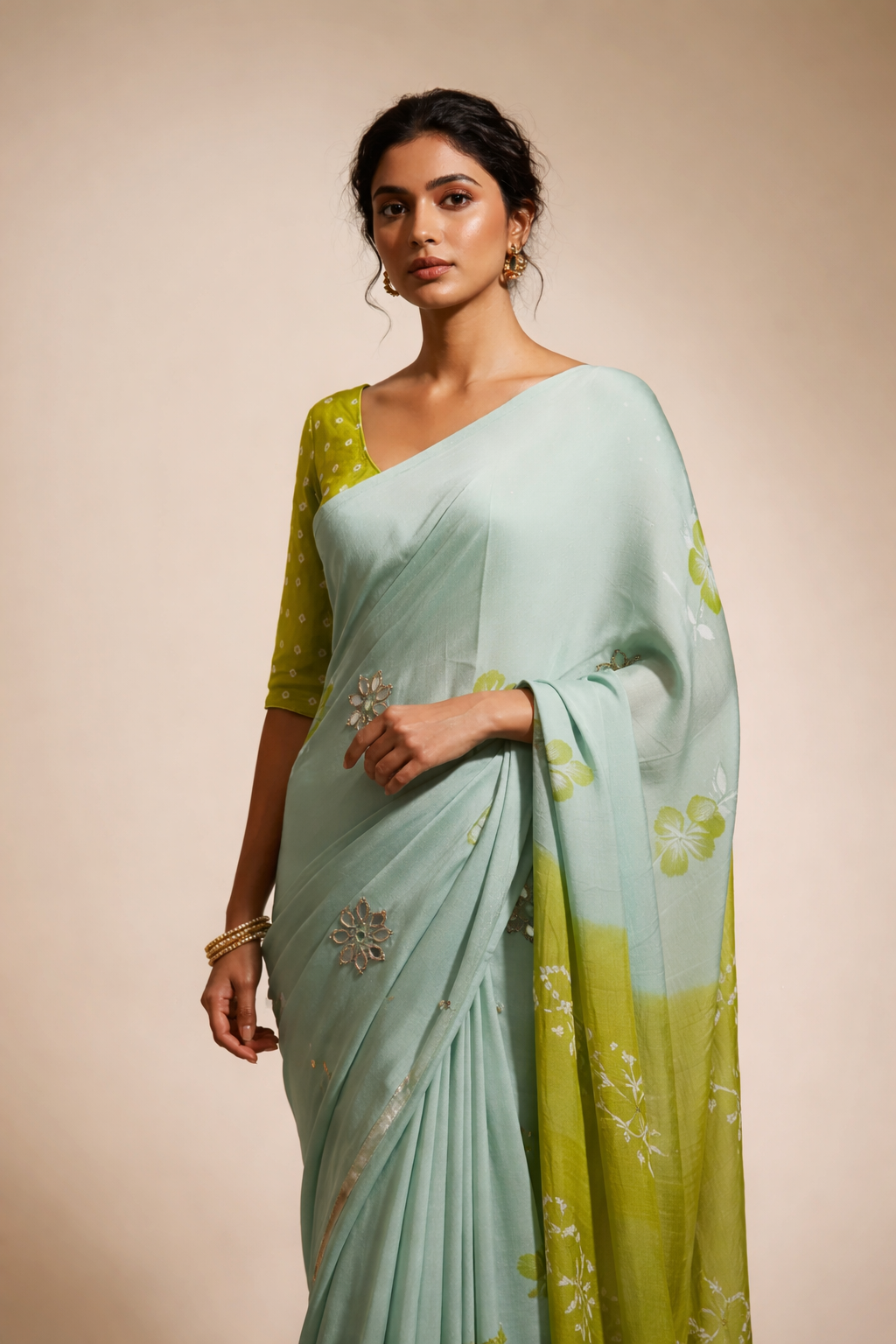 Model wearing elegant sage green traditional saree